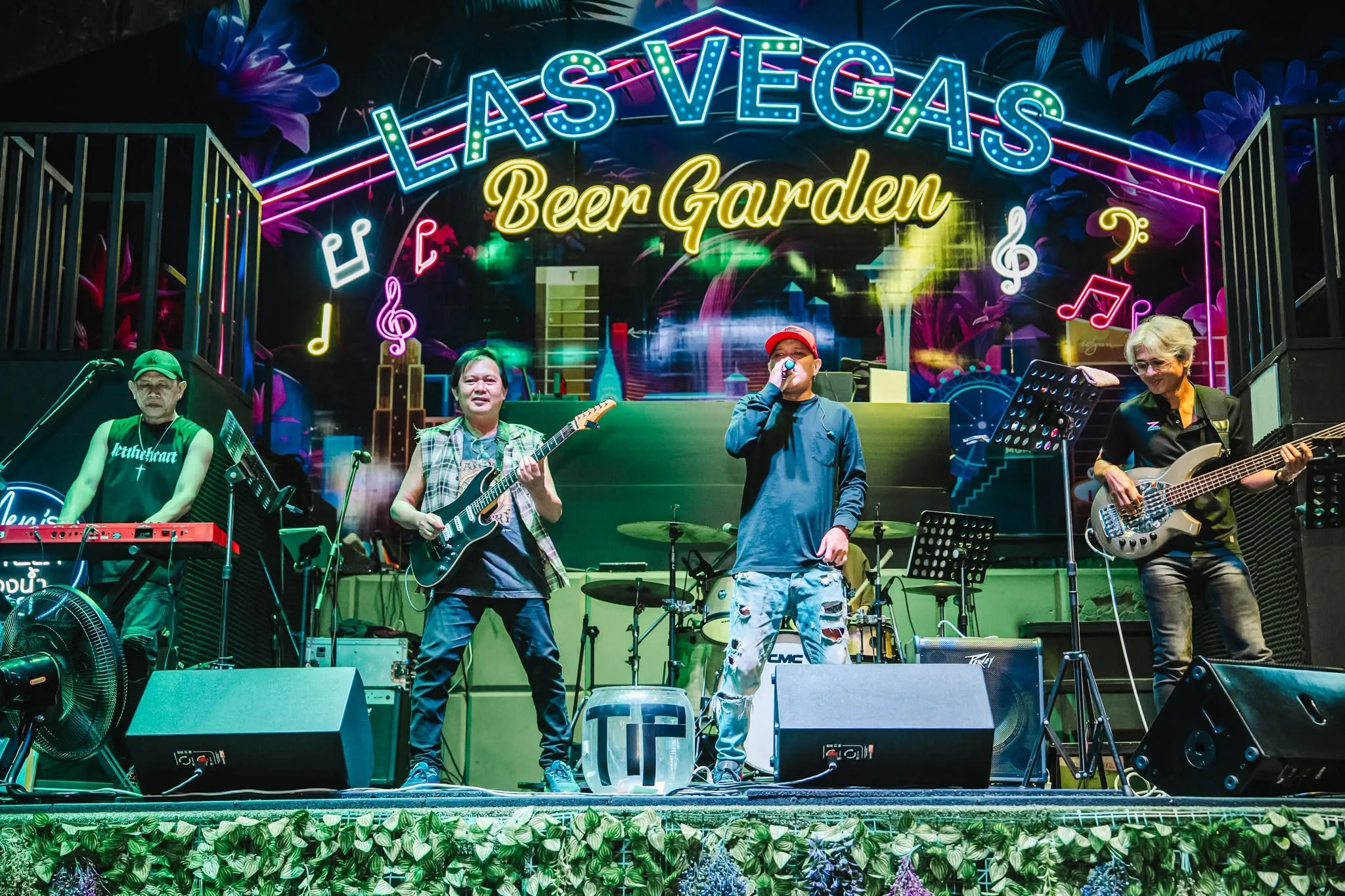 MHz Band Thailand on the Las Vegas Beer Garden stage under the neon sign